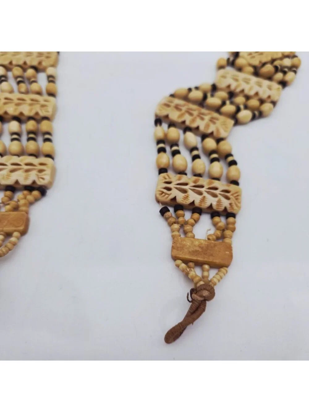 Hand-Carved Bone Beaded Belt With Intricate Leaf Pattern & Button Closure